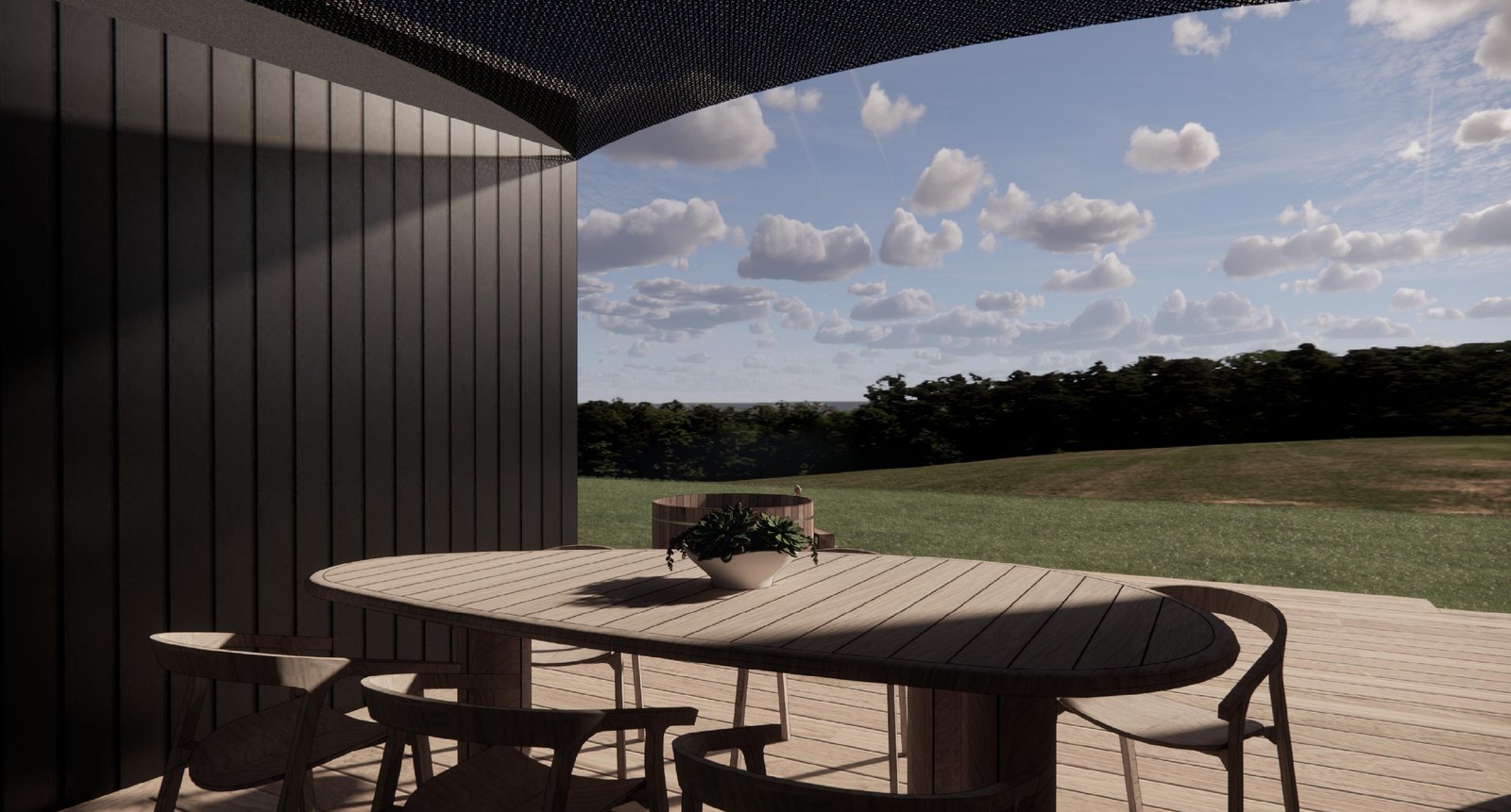 Covered outdoor deck dining area overlooking countryside